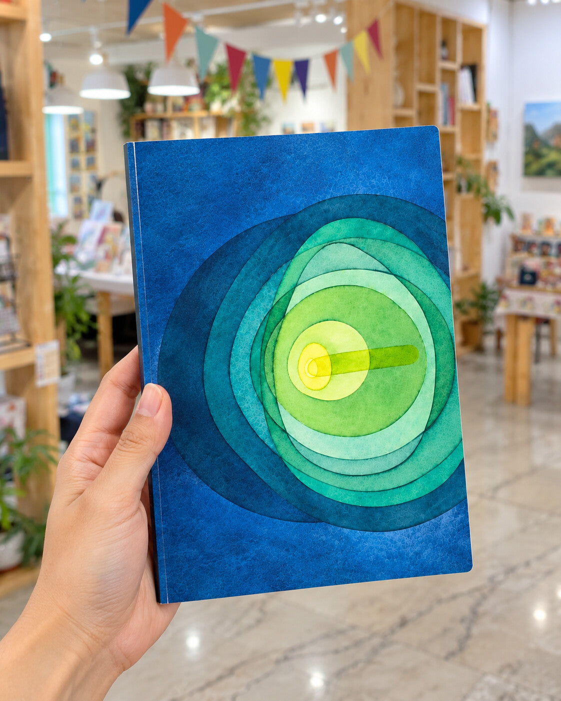 Ripple A5 softcover art journal held in hand at Alive Studio
