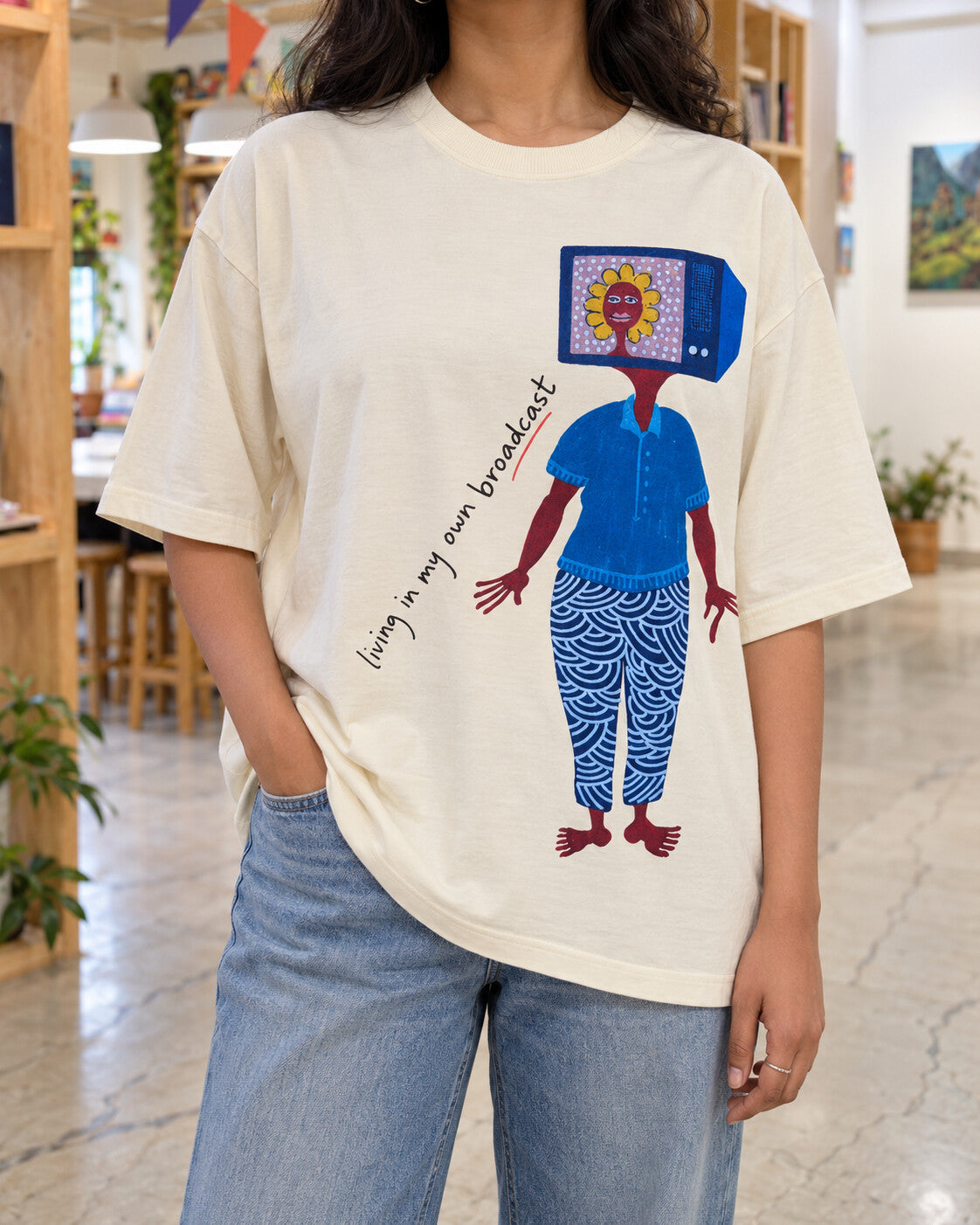 Oversized cream Broadcast printed T-shirt, worn at Alive Studio