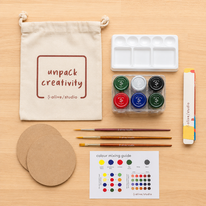 Painting essentials with acrylic paints, artist brushes, mixing palette and colour-mixing guide
